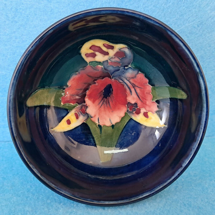 A Moorcroft Footed Bowl in the Orchid Design by Walter Moorcroft