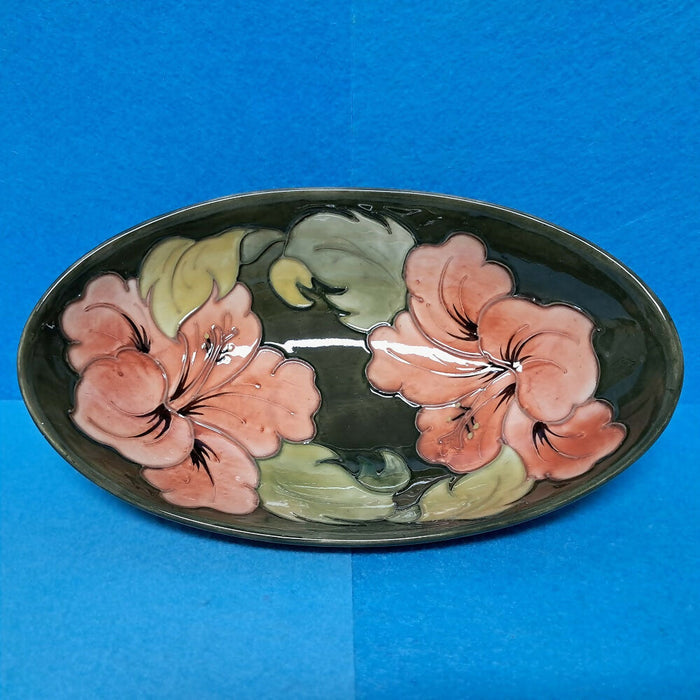 A Moorcroft Oval Bowl in the Coral Hibiscus Design by Walter Moorcroft