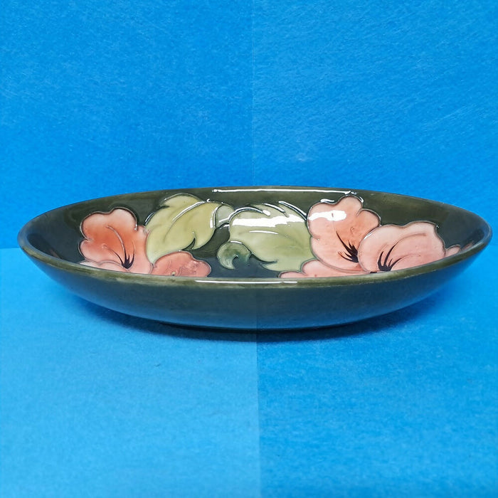 A Moorcroft Oval Bowl in the Coral Hibiscus Design by Walter Moorcroft