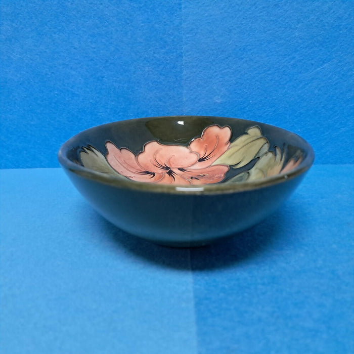 A Moorcroft Oval Bowl in the Coral Hibiscus Design by Walter Moorcroft