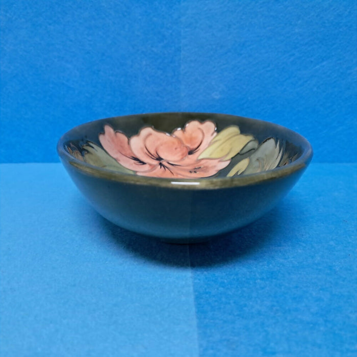 A Moorcroft Oval Bowl in the Coral Hibiscus Design by Walter Moorcroft
