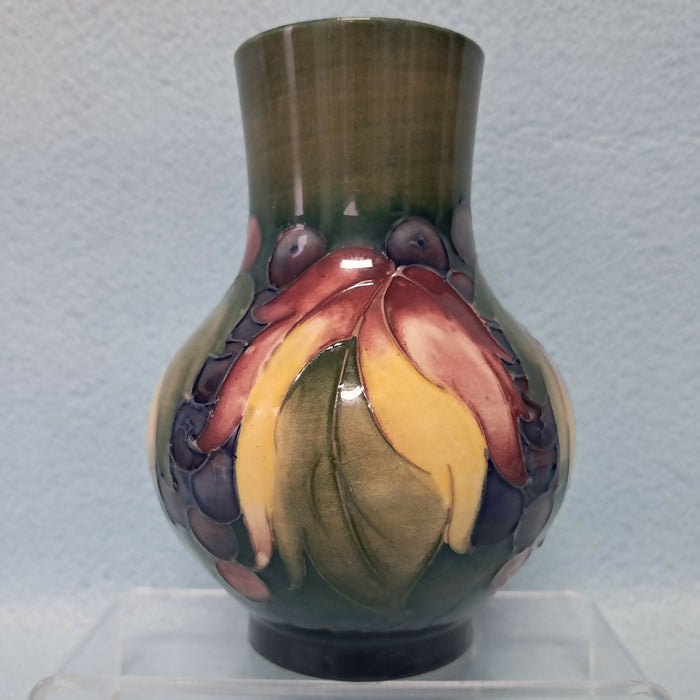 A Moorcroft Vase in the Leaf and Berry Design by William Moorcroft