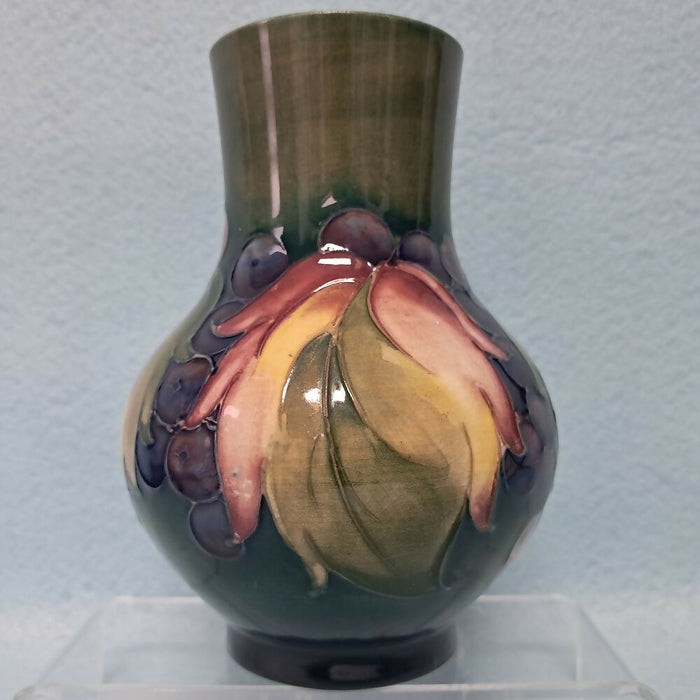 A Moorcroft Vase in the Leaf and Berry Design by William Moorcroft