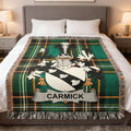 Carmick family crest woven blanket folded at the end of a bed.