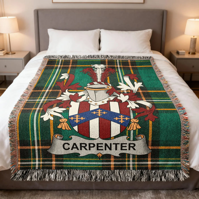 Carpenter family crest woven blanket spread over a bed.