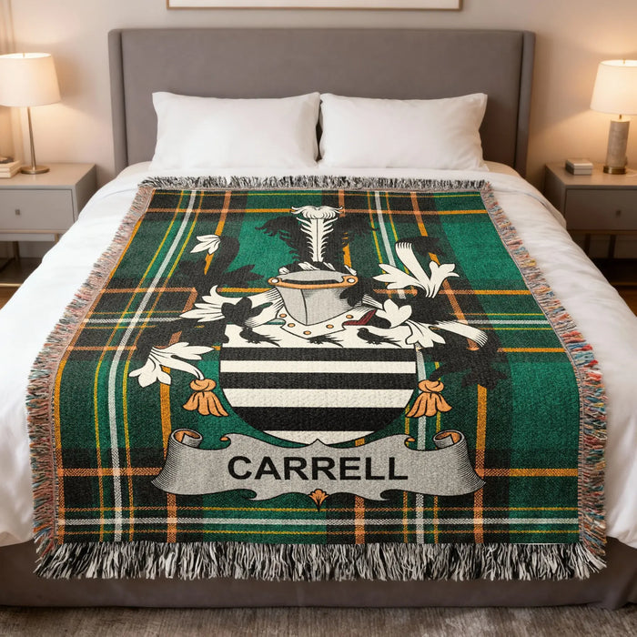 Carrell family crest woven blanket spread over a bed.