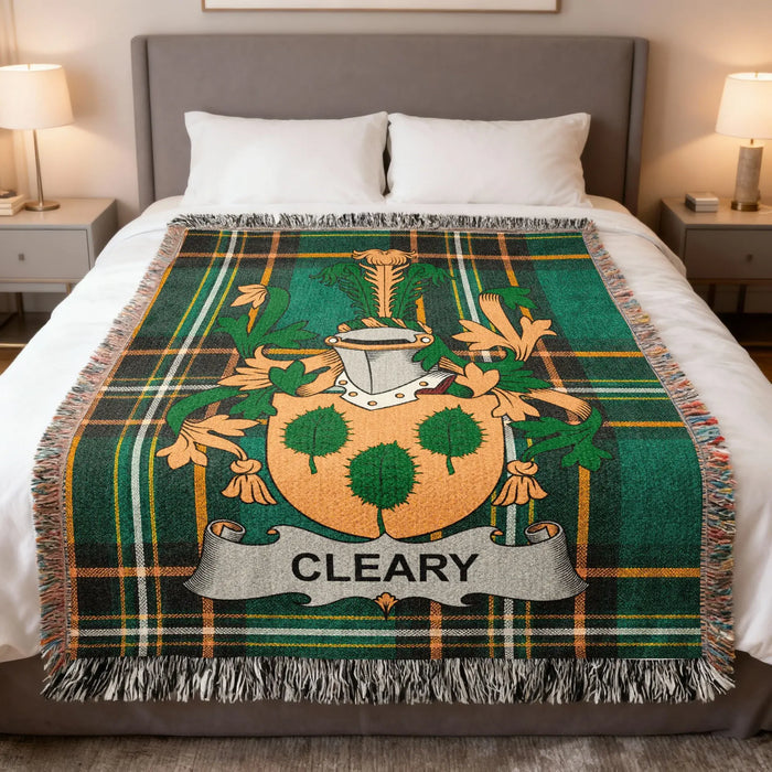 Cleary family crest woven blanket laid across a bed.