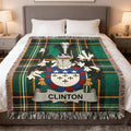 Clinton family crest woven blanket laid across a bed.