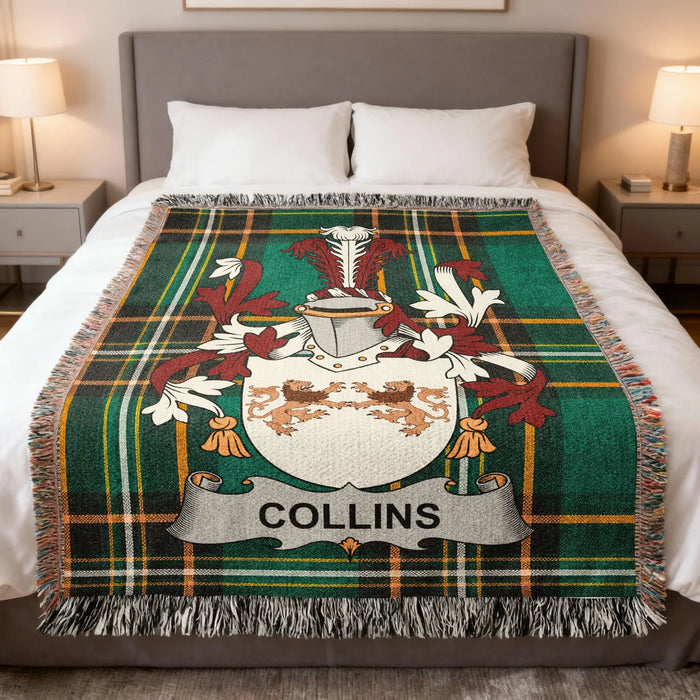 Collins surname emblem woven blanket spread across a bed.