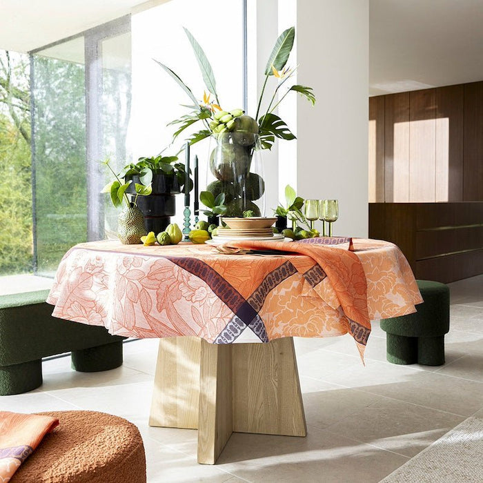 escapade tropicale orange tablecloth by le jacquard français - Round table at Fig Linens and Home