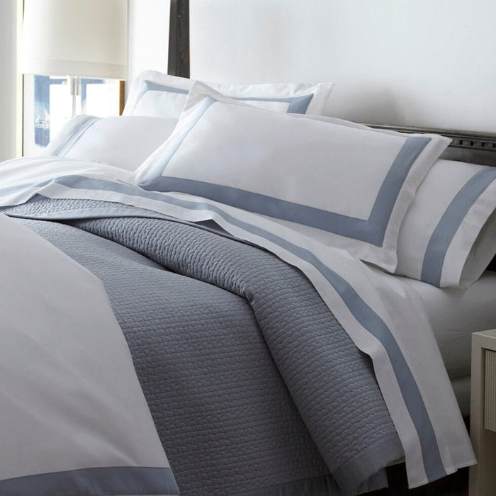 Peacock Alley Coverlets | Hamilton Blue Quilted Coverlet Close-up View on Bed with Bed Sheets