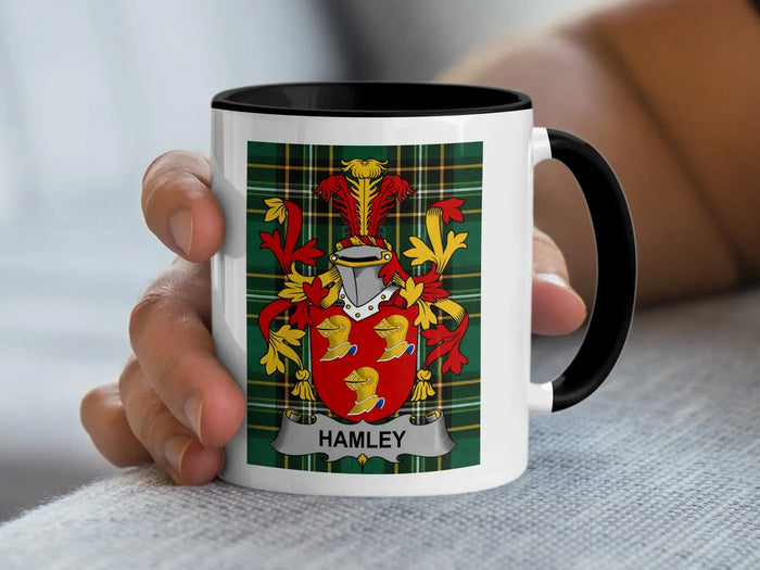 Mug with Hamley family crest on plaid background.