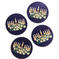 Four coasters with embroidered designs of a menorah and flowers on a blue background.