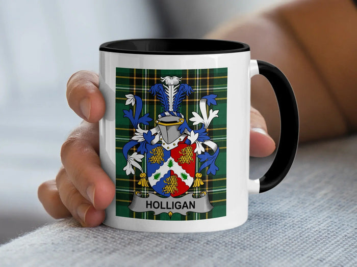 White mug with black rim featuring a detailed coat of arms and the name HOLLIGAN.