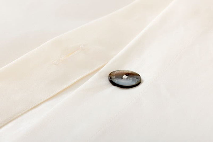 Duvet button Prodige Crème Bedding by Yves Delorme Couture at Fig Linens and Home