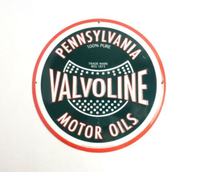 Retro-style "Valvoline Motor Oils" round tin sign featuring traditional Valvoline branding in red and green on a black background.